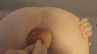 Horny boy sticks a full apple in his anus